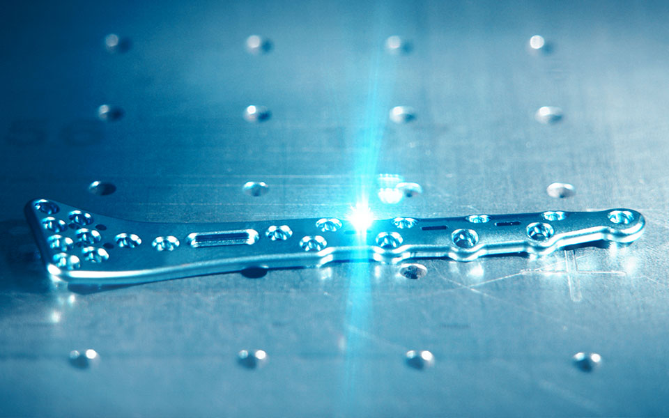 Image of a medical instrument undergoing laser marking, also known as laser engraving in the medical sector.