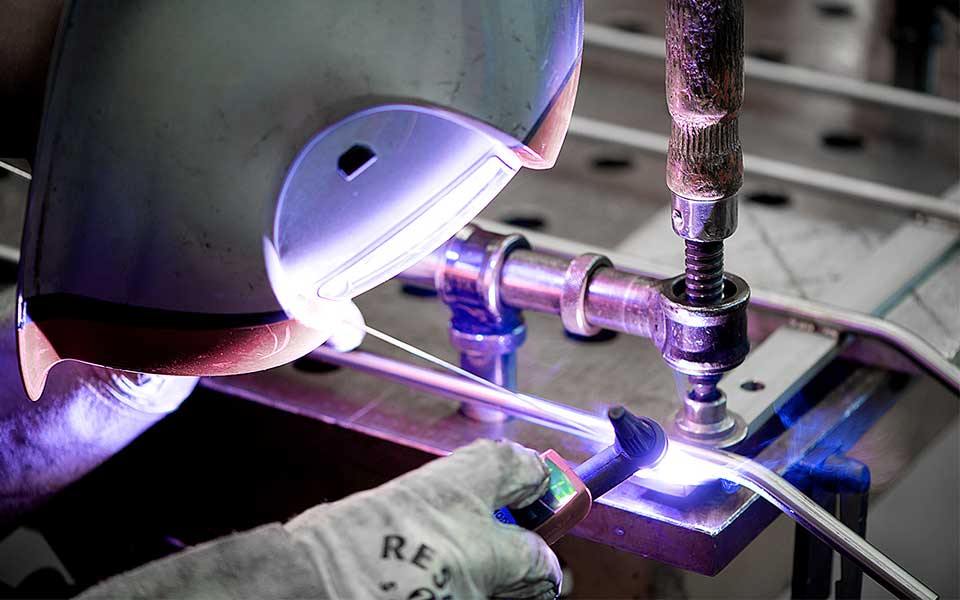 KKS metalwork specialist welding a system for ultrasonic cleaning and surface treatment.