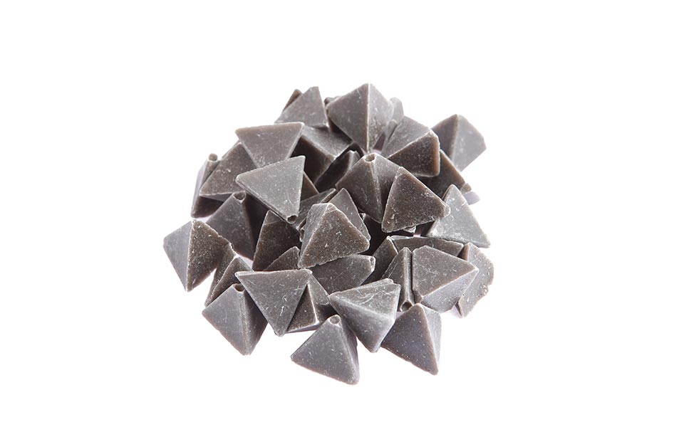 Dark gray abrasive particles as used by KKS for mass finishing of medical products