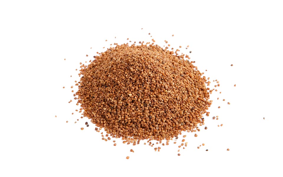 Brown, fine abrasive particles as used by KKS for mass finishing of medical products